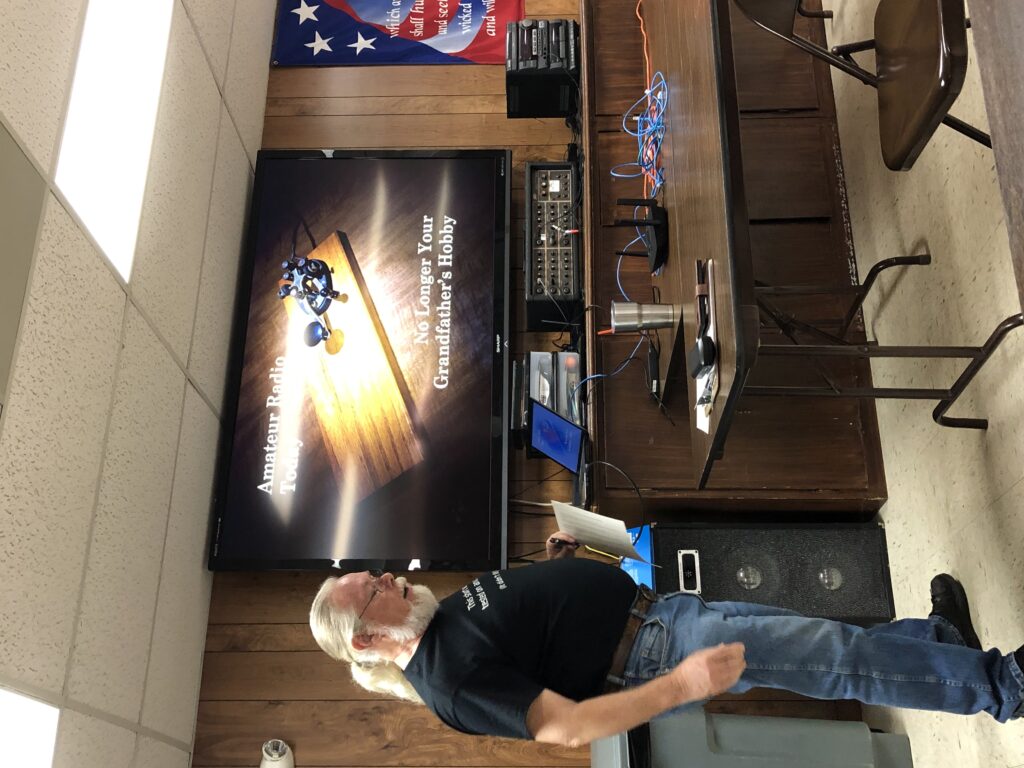 Ham operator in front of a TV screen